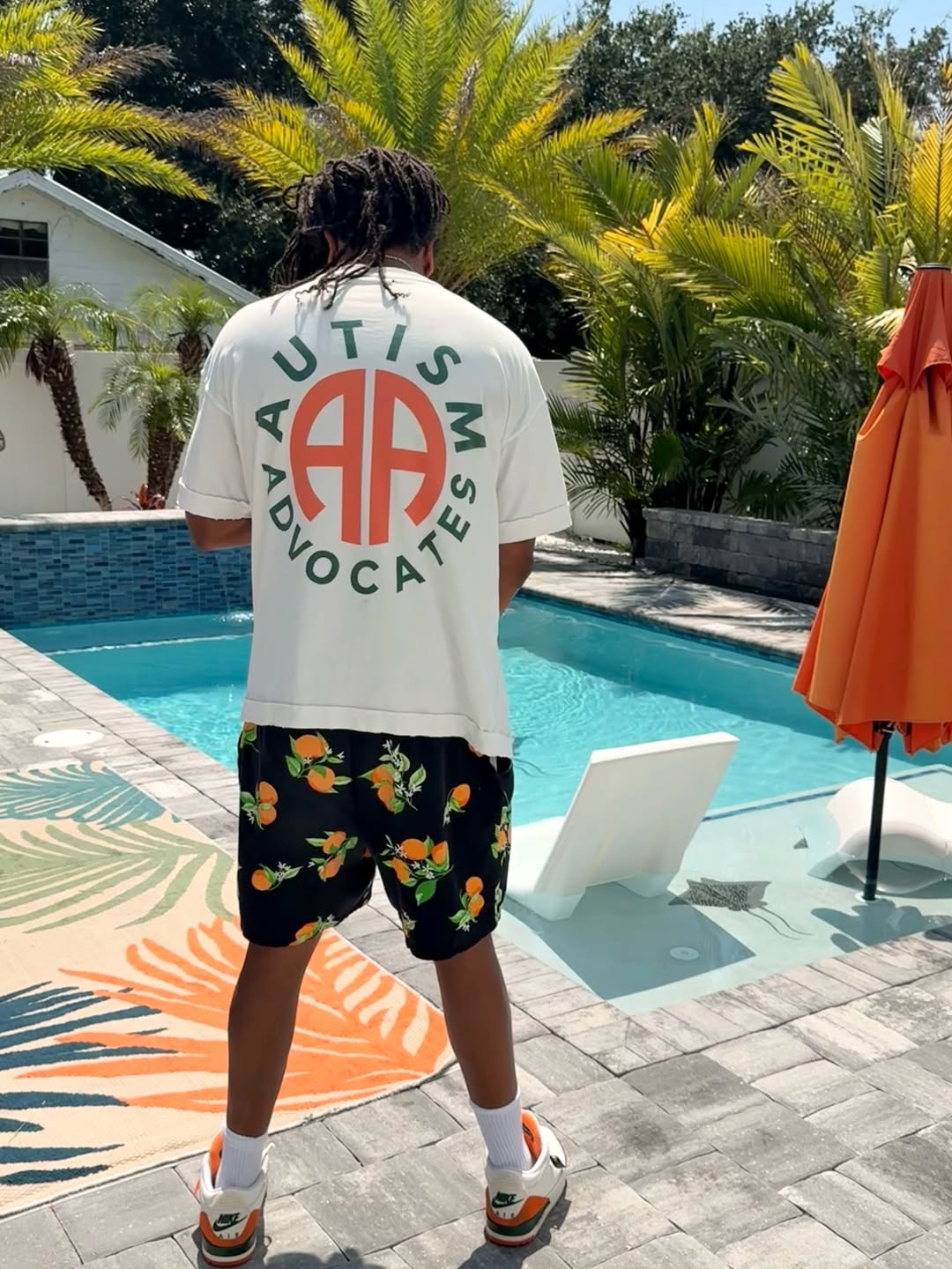 Autism Advocates poolside — shirt back